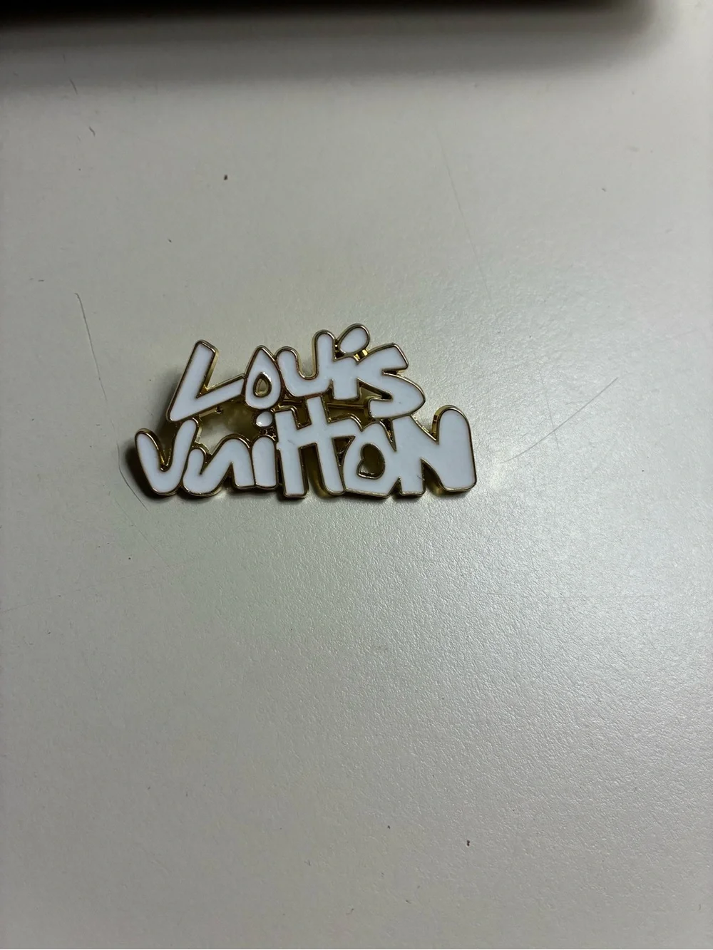 Luxury stamped LV White and Gold Logo Script Brooch